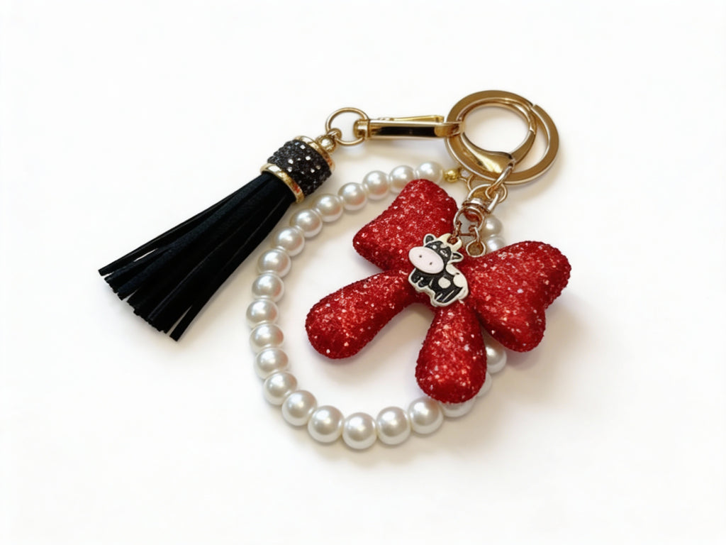 RHINESTONE BOW WITH PEARLS & BLACK TASSEL