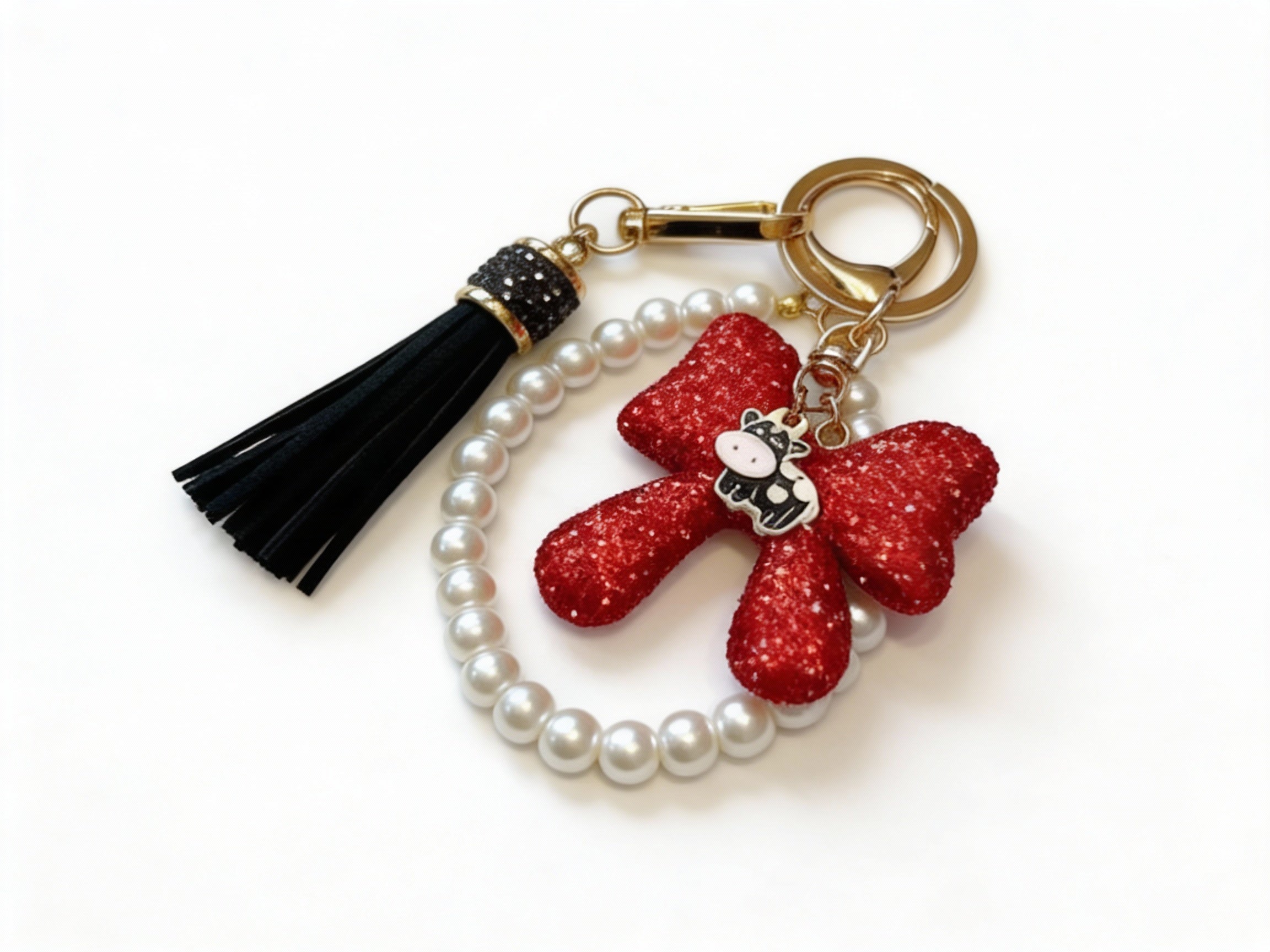 RHINESTONE BOW WITH PEARLS & BLACK TASSEL