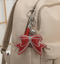 RED SPARKLE BOW WITH TOROS KEYCHAIN